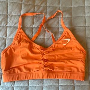 Orange gym shark sports bra
